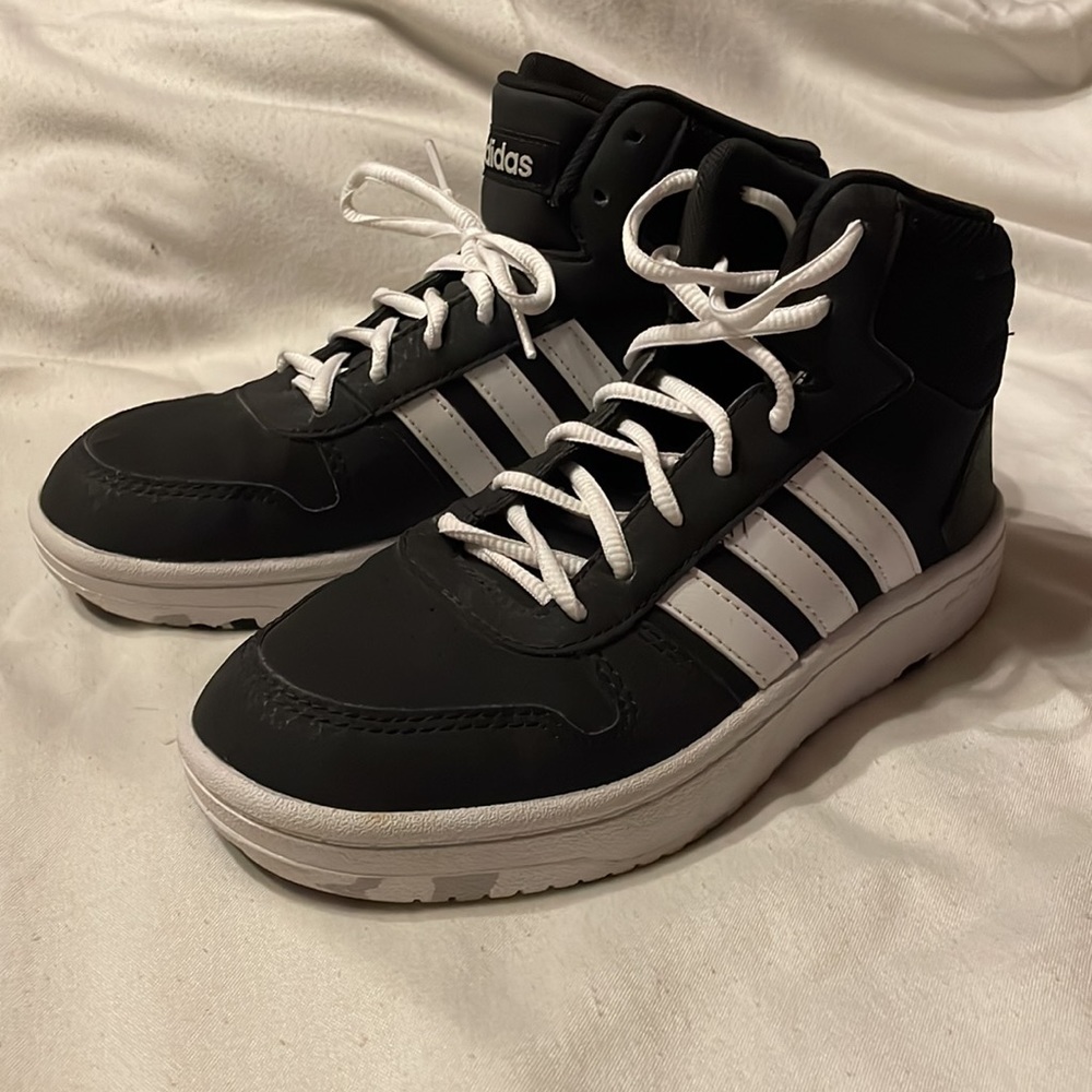 Never worn. Like new. Adidas girls basketball shoes. Size 5.